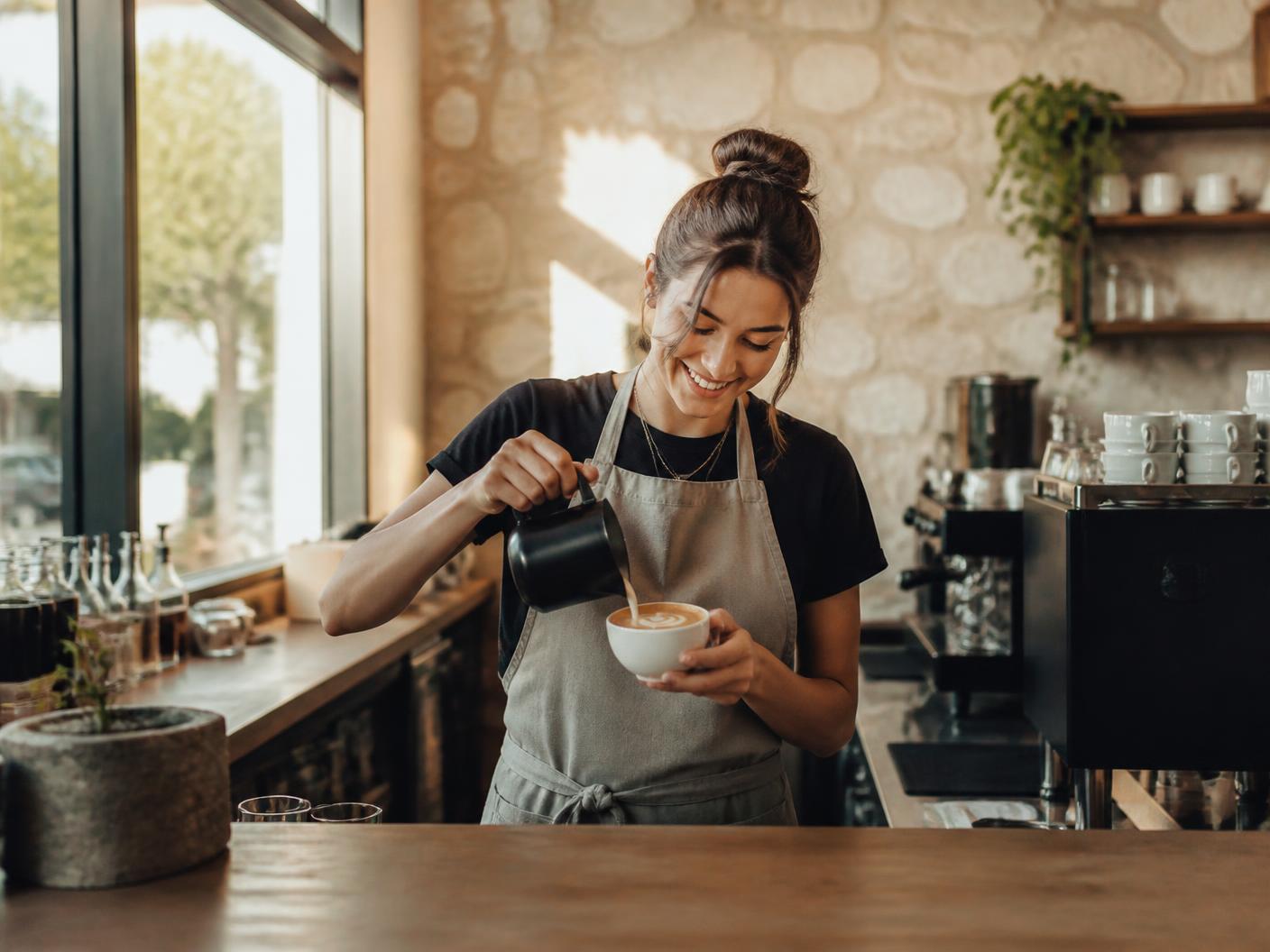 Krave barista making latte art